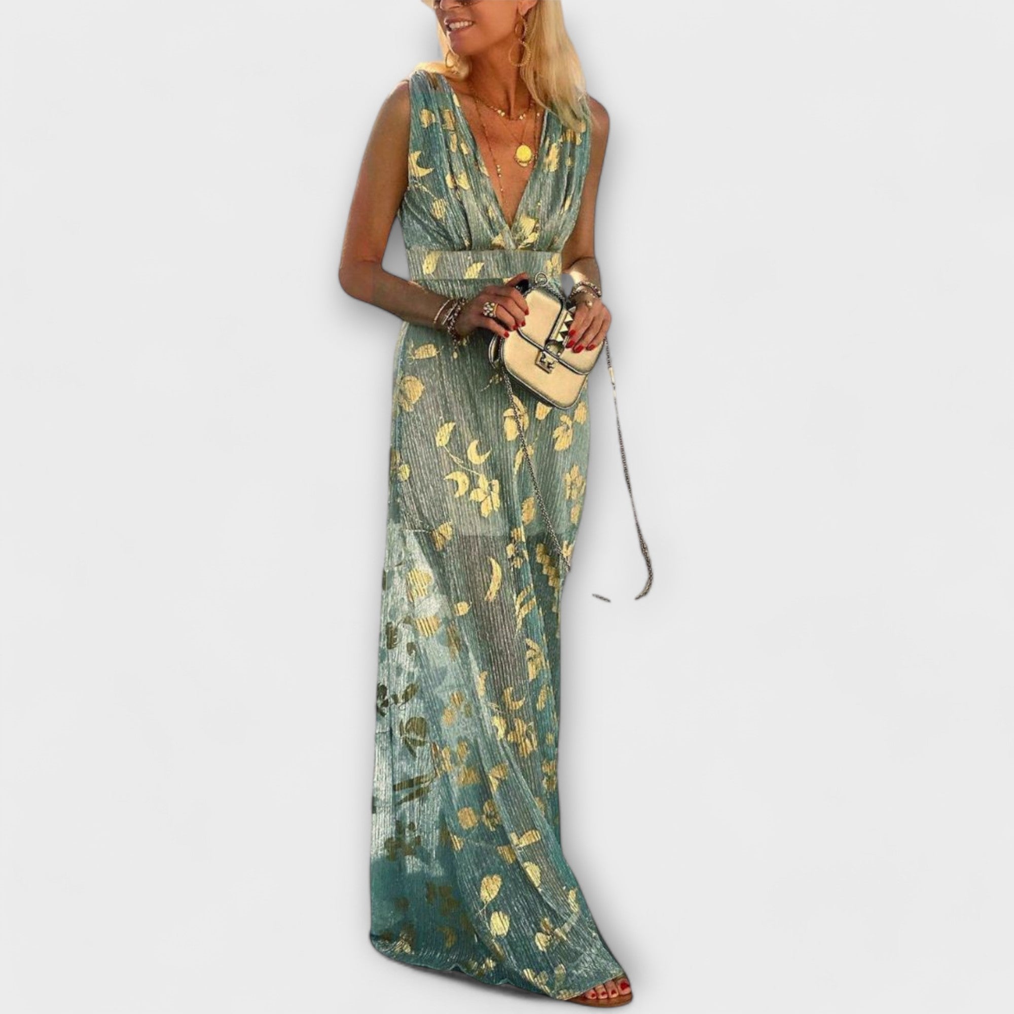 Fladdrande klänning med V-ringning och paljett detaljer