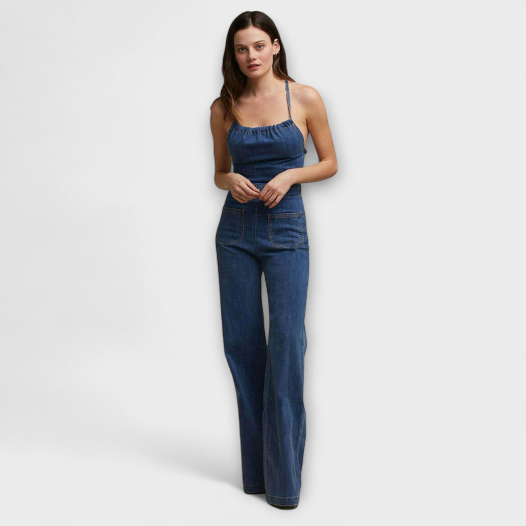 Julie - Denim jumpsuit met wijde pijpen en strikdetail